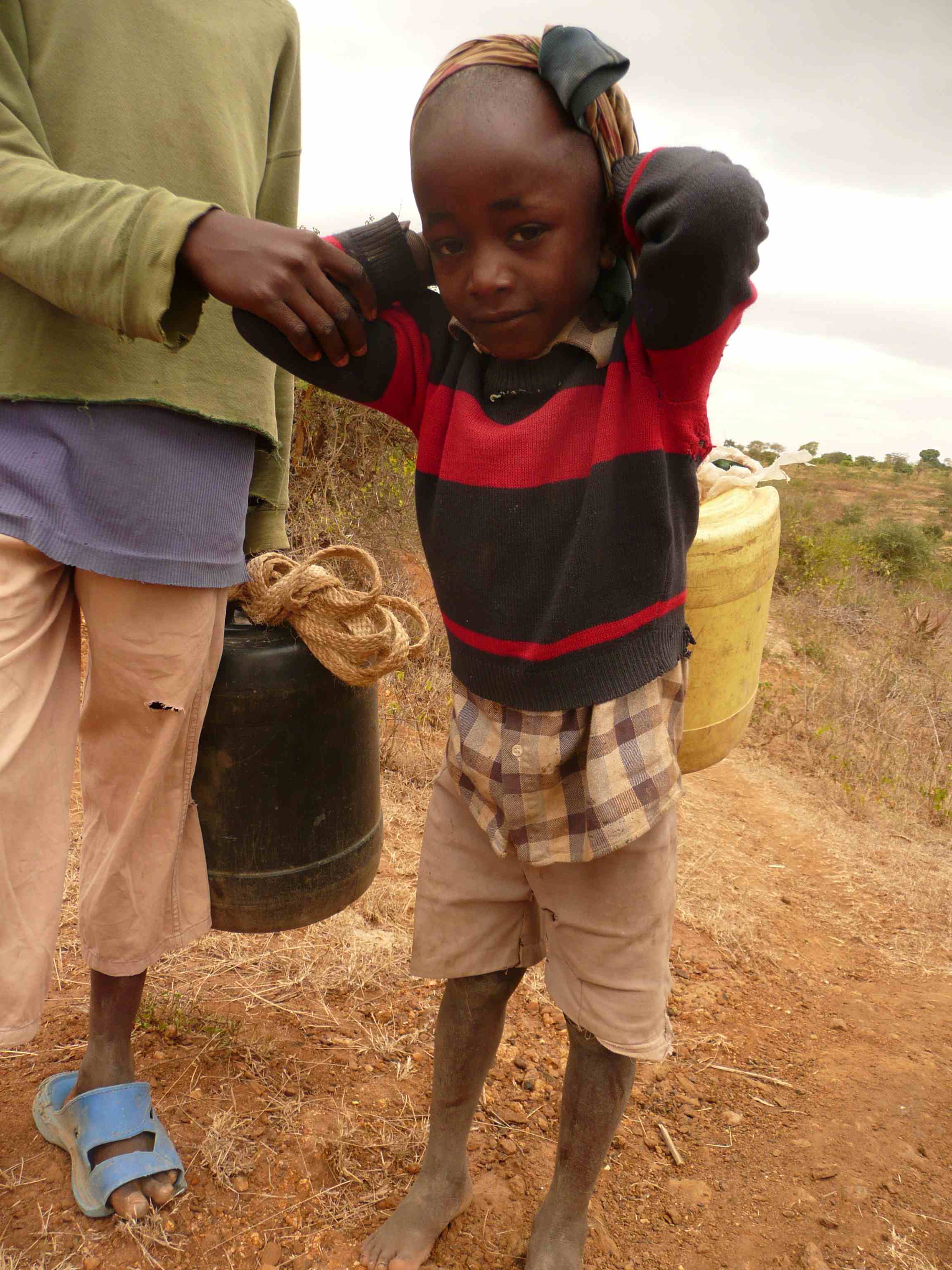 mulande carrying water